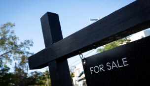 A "For Sale" sign stands at a house in Miami, Florida, U.S. April 16, 2025. REUTERS/Marco Bello