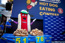 FILE PHOTO: Frankie, the mascot for Nathan's Famous hot dogs, excites the audience at the official weigh-in ceremony, ahead of the Coney Island's 2025 Nathan's Famous Fourth of July International Hot Dog Eating Contest in New York City, U.S., July 3, 2025. REUTERS/Angelina Katsanis/File Photo