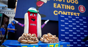 FILE PHOTO: Frankie, the mascot for Nathan's Famous hot dogs, excites the audience at the official weigh-in ceremony, ahead of the Coney Island's 2025 Nathan's Famous Fourth of July International Hot Dog Eating Contest in New York City, U.S., July 3, 2025. REUTERS/Angelina Katsanis/File Photo