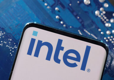 A smartphone with an Intel logo displayed is placed on a computer motherboard in this illustration created on March 6, 2023. REUTERS/Dado Ruvic/Illustration/File Photo
