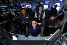 Traders work on the floor at the New York Stock Exchange (NYSE) in New York City, U.S., January 13, 2026. REUTERS/Brendan McDermid