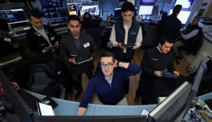 Traders work on the floor at the New York Stock Exchange (NYSE) in New York City, U.S., January 13, 2026. REUTERS/Brendan McDermid