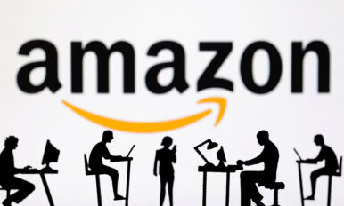 Figurines with computers and smartphones are seen in front of Amazon logo in this illustration taken, February 19, 2024. REUTERS/Dado Ruvic/Illustration