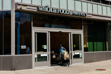 An Amazon employee pushes shopping carts out of Whole Foods Market in Philadelphia, Pennsylvania, U.S. September 3, 2025. REUTERS/Hannah Beier