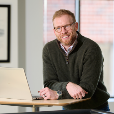 Oasis Digital Properties co-founder and partner Ross Litkenhous stands at the firm's office in Falls Church. Litkenhous helped found the firm to capitalize on data center development moving outside of Northern Virginia. Photo by Shannon Ayres