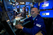 Traders work on the floor at the New York Stock Exchange (NYSE) in New York City, U.S., January 13, 2026. REUTERS/Brendan McDermid