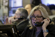 FILE PHOTO: Traders work on the floor of the New York Stock Exchange January 20, 2016. REUTERS/Brendan McDermid/File Photo