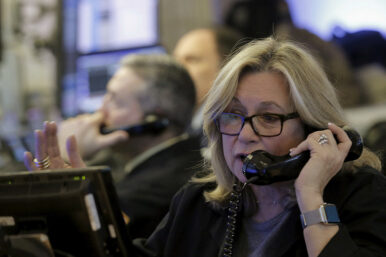 FILE PHOTO: Traders work on the floor of the New York Stock Exchange January 20, 2016. REUTERS/Brendan McDermid/File Photo