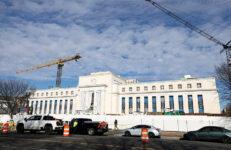 Cranes loom over the construction site of the Federal Reserve headquarters amid renovations of the building, in Washington, D.C., U.S., January 12, 2026. REUTERS/Kevin Lamarque/File Photo