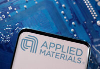 A smartphone with a displayed Applied Materials logo is placed on a computer motherboard in this illustration taken March 6, 2023. REUTERS/Dado Ruvic/Illustration/File Photo