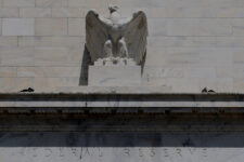 An eagle tops the U.S. Federal Reserve building's facade, as U.S. President Donald Trump said he was firing Federal Reserve Governor Lisa Cook over alleged improprieties in obtaining mortgage loans, in Washington, D.C., U.S., August 26, 2025. REUTERS/Brian Snyder