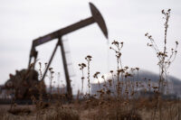 A pump jack operates near a crude oil reserve in the Permian Basin oil field near Midland, Texas, U.S. February 18, 2025. REUTERS/Eli Hartman/File Photo