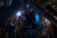 Workers weld at a factory floor in Columbus, Ohio, U.S., March 26, 2024. REUTERS/Carlos Barria