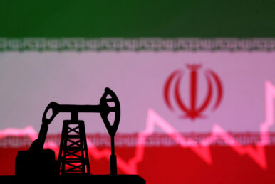 Iranian flag with stock graph and an oil pump jack miniature model are seen in this illustration taken October 9, 2023. REUTERS/Dado Ruvic/Illustration