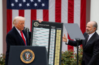 FILE PHOTO: U.S. President Donald Trump holds a chart next to U.S. Secretary of Commerce Howard Lutnick as Trump delivers remarks on tariffs in the Rose Garden at the White House in Washington, D.C., U.S., April 2, 2025. REUTERS/Carlos Barria//File Photo