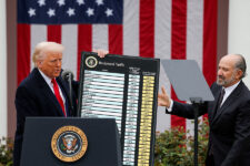 FILE PHOTO: U.S. President Donald Trump holds a chart next to U.S. Secretary of Commerce Howard Lutnick as Trump delivers remarks on tariffs in the Rose Garden at the White House in Washington, D.C., U.S., April 2, 2025. REUTERS/Carlos Barria//File Photo