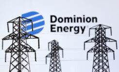 Electric power transmission pylon miniatures and Dominion Energy logo are seen in this illustration taken, December 9, 2022. REUTERS/Dado Ruvic/Illustration