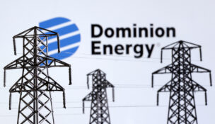Electric power transmission pylon miniatures and Dominion Energy logo are seen in this illustration taken, December 9, 2022. REUTERS/Dado Ruvic/Illustration