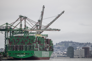 Shipping containers are stacked on a cargo ship at the port of Oakland following the Supreme Court's ruling that Trump had exceeded his authority when he imposed tariffs, in Oakland, California, U.S., February 24, 2026. REUTERS/Carlos Barria