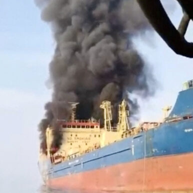 Smoke billows from an oil tanker under U.S. sanctions, that was hit off Oman's Musandam peninsula, in this screen grab from a video obtained by REUTERS on March 1, 2026.