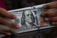 US dollar firms on renewed inflation risks; market pares back rate-cut outlook 