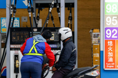 A staff member refuels a motorbike at a gas station in Taipei, Taiwan, March 9, 2026. REUTERS/Ann Wang
