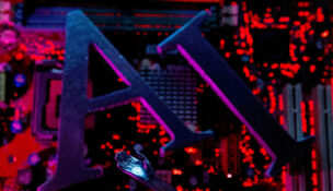 FILE PHOTO: AI (Artificial Intelligence) letters and robot hand are placed on computer motherboard in this illustration created on June 23, 2023. REUTERS/Dado Ruvic/Illustration/File Photo