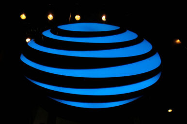 The AT&T logo is seen in a store window in the Manhattan borough of New York City, New York, U.S., January 19, 2022. REUTERS/Brendan McDermid