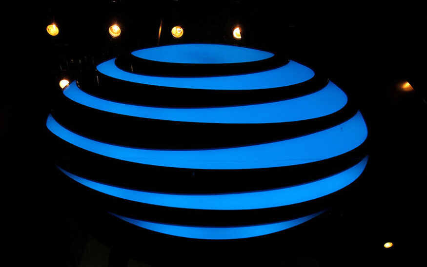 The AT&T logo is seen in a store window in the Manhattan borough of New York City, New York, U.S., January 19, 2022. REUTERS/Brendan McDermid