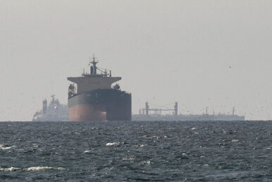 FILE PHOTO: Tankers sail in the Gulf, near the Strait of Hormuz, as seen from northern Ras al-Khaimah, near the border with Oman’s Musandam governance, amid the U.S.-Israeli conflict with Iran, in United Arab Emirates, March 11, 2026. REUTERS/Stringer/File Photo