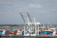 Shipping containers are stacked at a terminal at the port of Los Angeles in Long Beach, California, U.S., March 10, 2026. REUTERS/Caroline Brehman