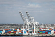 Shipping containers are stacked at a terminal at the port of Los Angeles in Long Beach, California, U.S., March 10, 2026. REUTERS/Caroline Brehman