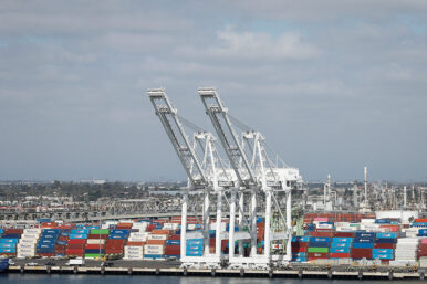 Shipping containers are stacked at a terminal at the port of Los Angeles in Long Beach, California, U.S., March 10, 2026. REUTERS/Caroline Brehman