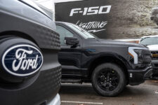A few 2025 Ford F-150 Lightning XLT trucks are parked on a lot at Village Ford dealership in Dearborn on Wednesday, Jan. 7, 2026.
