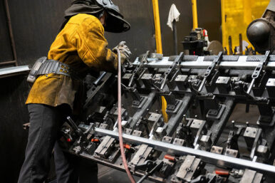 A worker prepares steel to be automatically welded at HCC, a company that uses parts to make combines, at the factory in Mendota, Illinois, U.S., February 21, 2025. REUTERS/Vincent Alban