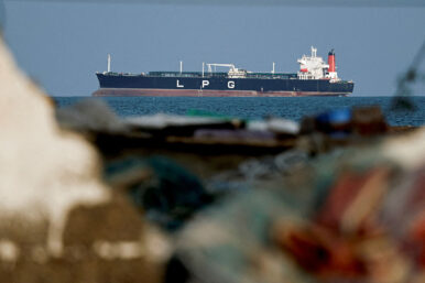 An LPG gas tanker at anchor as traffic is down in the Strait of Hormuz, amid the U.S.-Israeli conflict with Iran, in Shinas, Oman, March 11, 2026. REUTERS/Benoit Tessier/File Photo