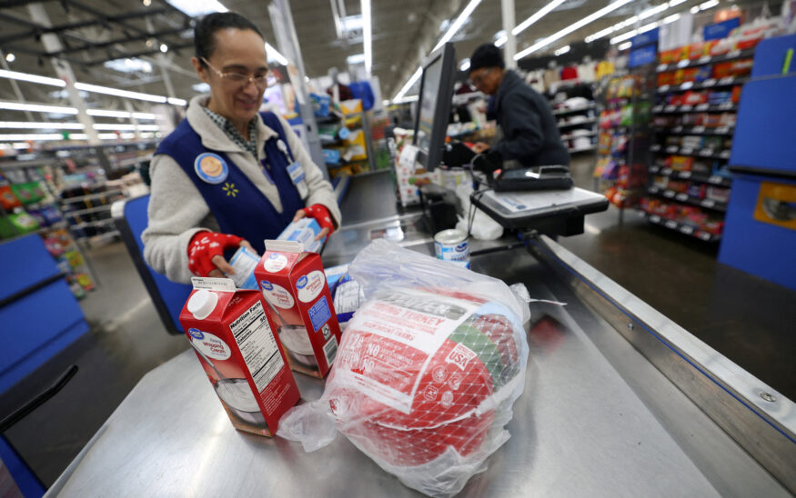 A cashier loads a turkey and other groceries for checkout at a Walmart Supercenter retail store in North Bergen, New Jersey, U.S., November 21, 2025. REUTERS/Mike Segar/File Photo