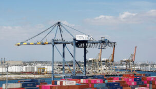 Shipping containers are stacked at a terminal at the port of Los Angeles in Long Beach, California, U.S., March 10, 2026. REUTERS/Caroline Brehman