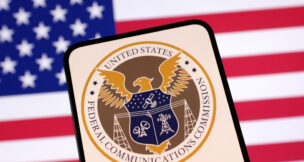 United States Federal Communications Commission logo and U.S. flag are seen in this illustration taken April 23, 2025. REUTERS/Dado Ruvic/Illustration
