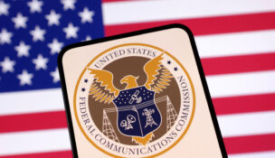 United States Federal Communications Commission logo and U.S. flag are seen in this illustration taken April 23, 2025. REUTERS/Dado Ruvic/Illustration