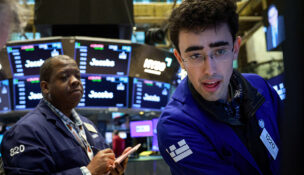 Traders work on the floor at the New York Stock Exchange (NYSE) in New York City, U.S., March 23, 2026. REUTERS/Brendan McDermid