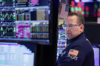 A trader works on the floor at the New York Stock Exchange (NYSE) in New York City, U.S., March 24, 2026. REUTERS/Jeenah Moon