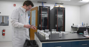 William Hedley, operations manager for Aclara Resources' Blacksburg pilot plant, works in the lab. Photo courtesy Aclara Resources