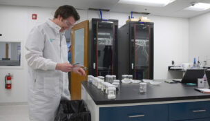 William Hedley, operations manager for Aclara Resources' Blacksburg pilot plant, works in the lab. Photo courtesy Aclara Resources