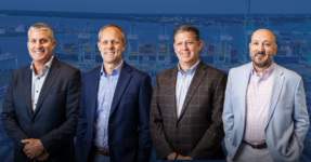 Cary Hagen, Bobby Scott, Kevin Briggs and Pete Hansen. Photo courtesy CV International. Background image courtesy of the Port of Virginia