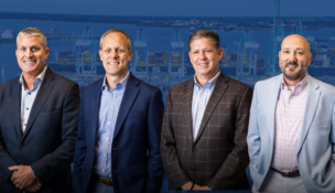 Cary Hagen, Bobby Scott, Kevin Briggs and Pete Hansen. Photo courtesy CV International. Background image courtesy of the Port of Virginia