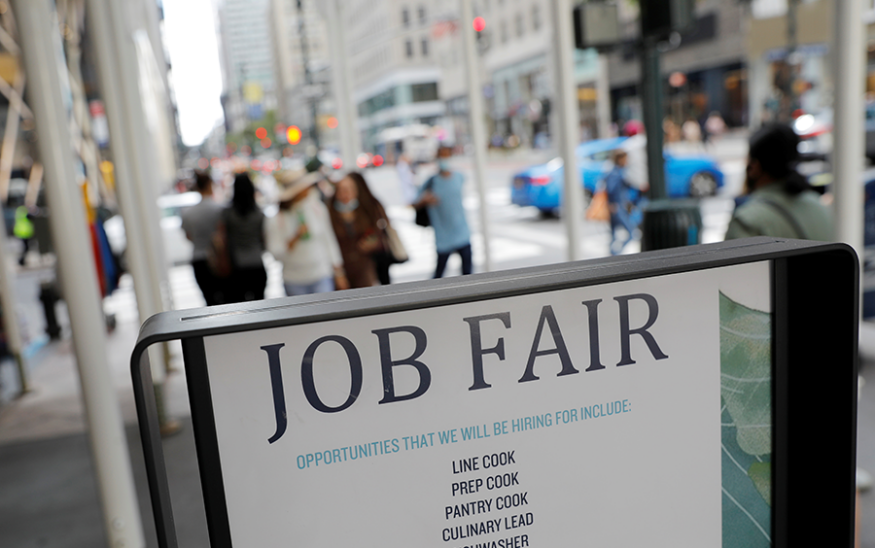 Signage for a job fair is seen on 5th Avenue after the release of the jobs report in Manhattan, New York City, on Sept. 3, 2021. Photo by Reuters/Andrew Kelly