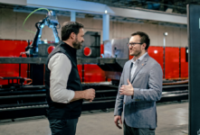 Huntington Ingalls Industries’ Eric Chewning (left) and Andy Lonsberry, Path Robotics’ CEO, announce their companies’ partnership.