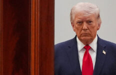 FILE PHOTO: President Donald Trump arrives from the Blue Room to speak about the Iran war from the Cross Hall of the White House on Wednesday, April 1, 2026, in Washington. Alex Brandon/Pool via REUTERS/File Photo