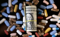 U.S. dollar banknotes and medicines are seen in this illustration taken, June 27, 2024. REUTERS/Dado Ruvic/Illustration